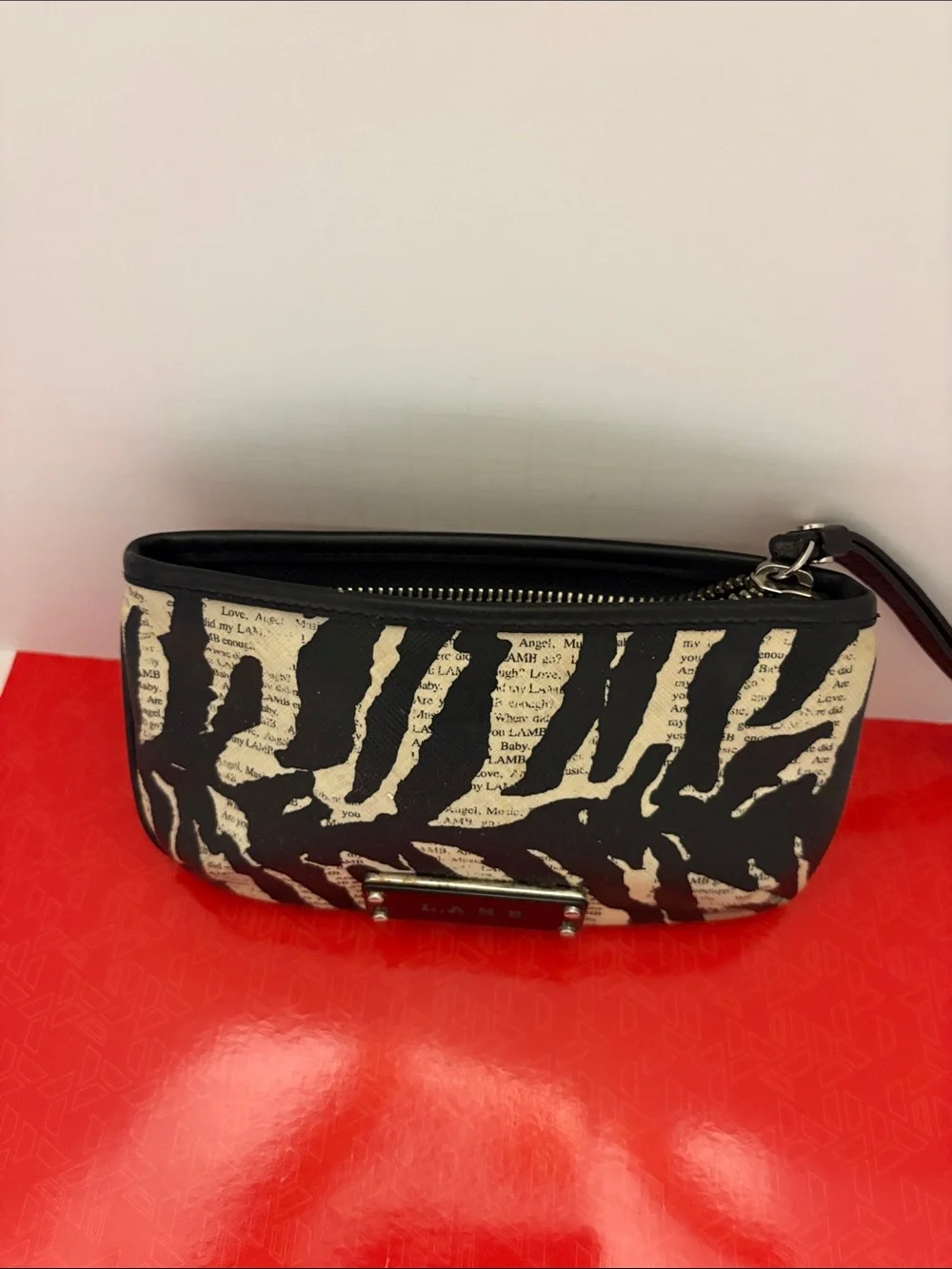 L.A.M.B. Black and Cream Zebra-Print Clutch with Logo Plate